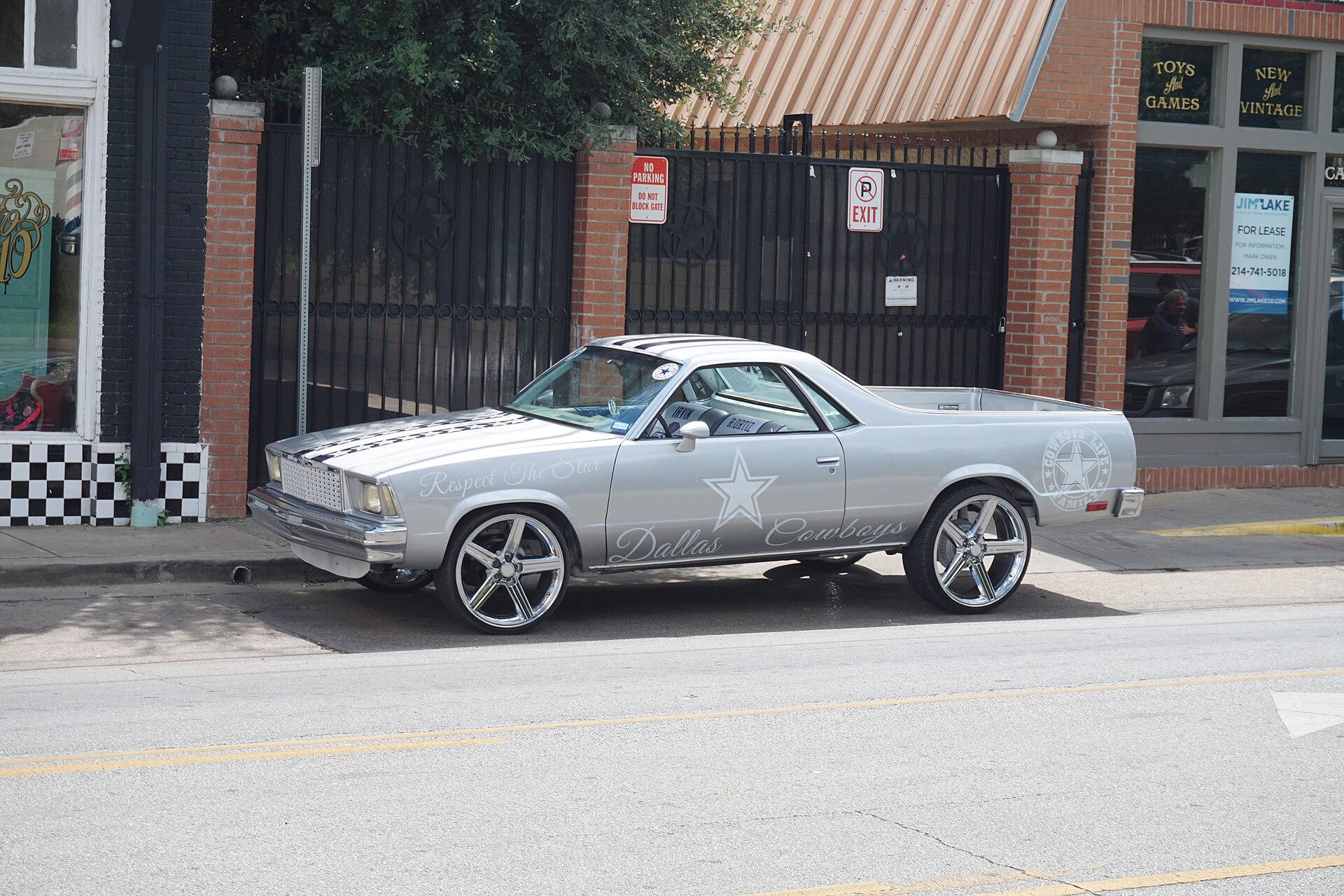 A Chevrolet El Camino painted in Dallas Cowboys colors parked in the Bishop Arts District
