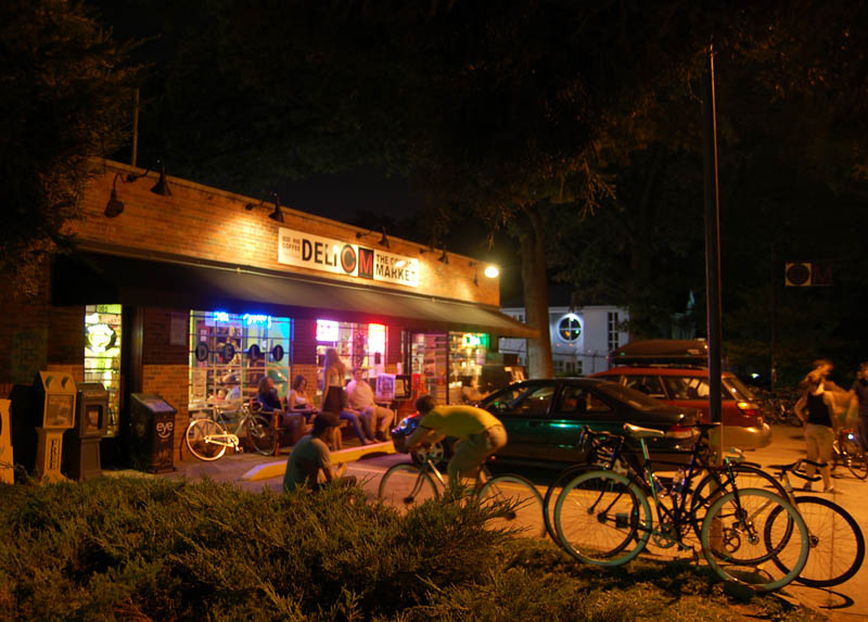 The Common Market deli on Commonwealth Avenue in Plaza Midwood, Charlotte, at night, with bicycles out front
